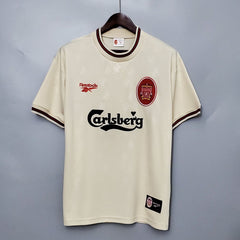 Liverpool 1996-97 Away Retro Jersey in ecru color with green collar, displaying the Carlsberg sponsor logo and the Liverpool FC crest.