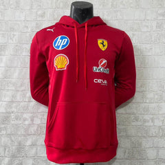 Red F1 hoodie with Ferrari logos on a mannequin against a textured white wall