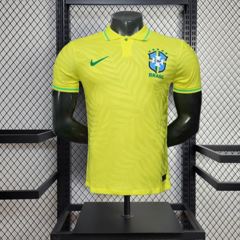 Brazil Yellow soccer jersey with Nike logo on a mannequin against a wire mesh background