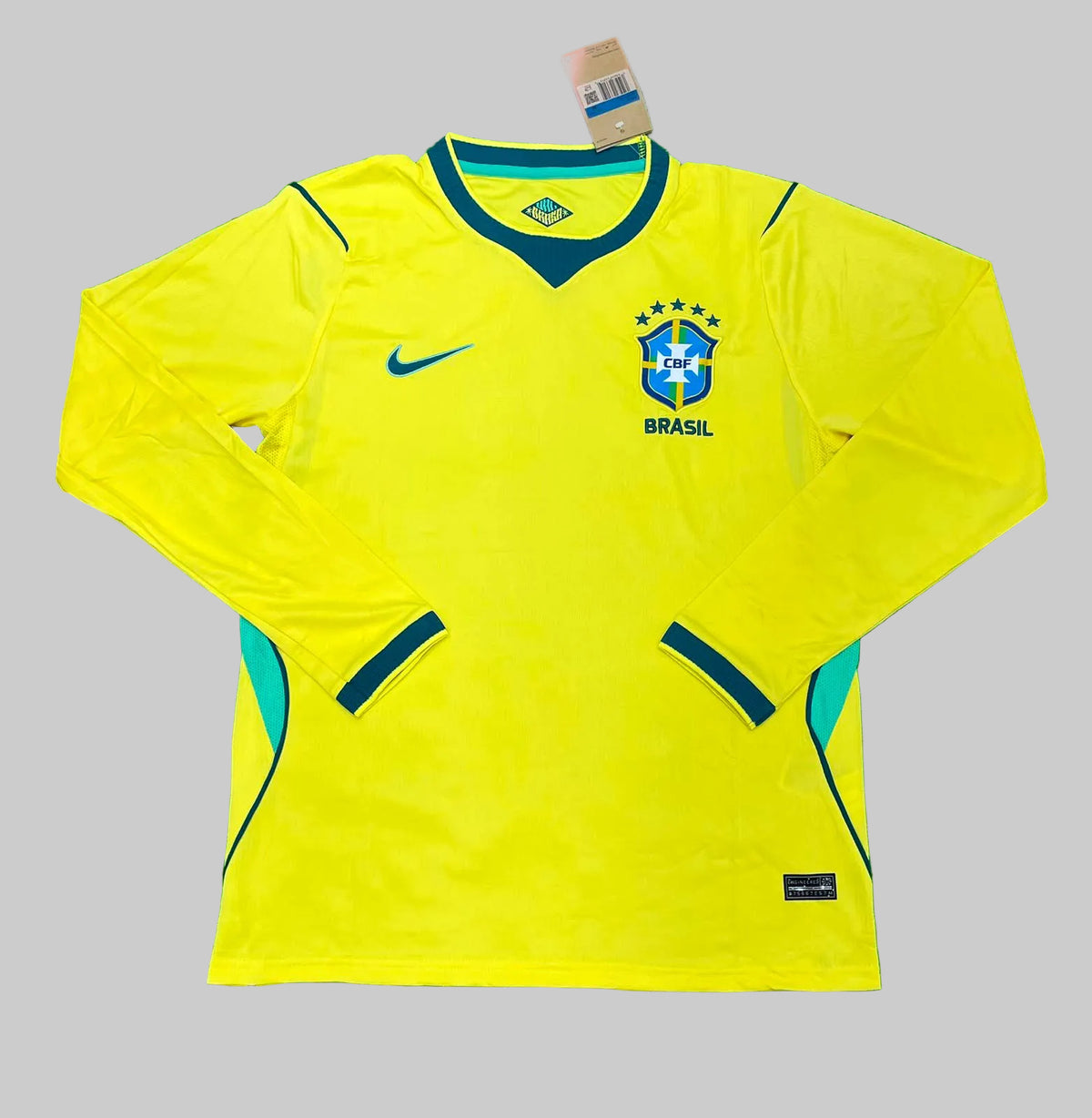 Yellow soccer jersey with Nike logo on a green background