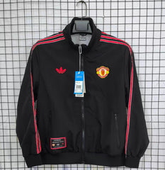 Black Man united jacket with red stripes featuring Adidas and Manchester United logos on a checkered background